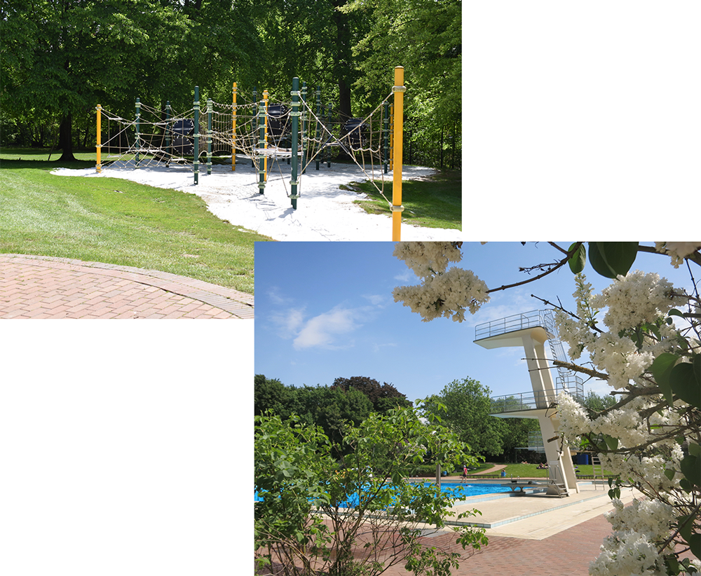 Kletterspielanlage im Grünen auf dem Gelände des Freibads Bürgerpark mit Sandfläche und schattenspendenden Bäumen. Sprungturm und Schwimmbecken im Freibad Bürgerpark mit blühenden Bäumen und großzügiger Liegewiese